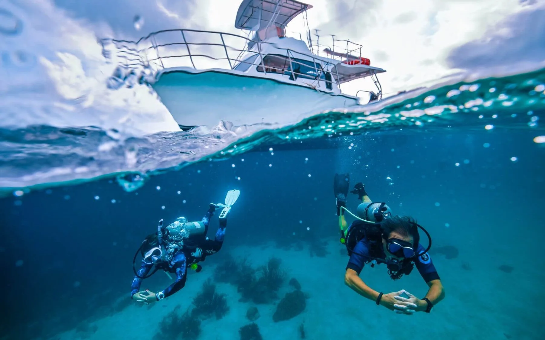 A diver descending over a reef off Haad Yao Beach, Koh Phangan